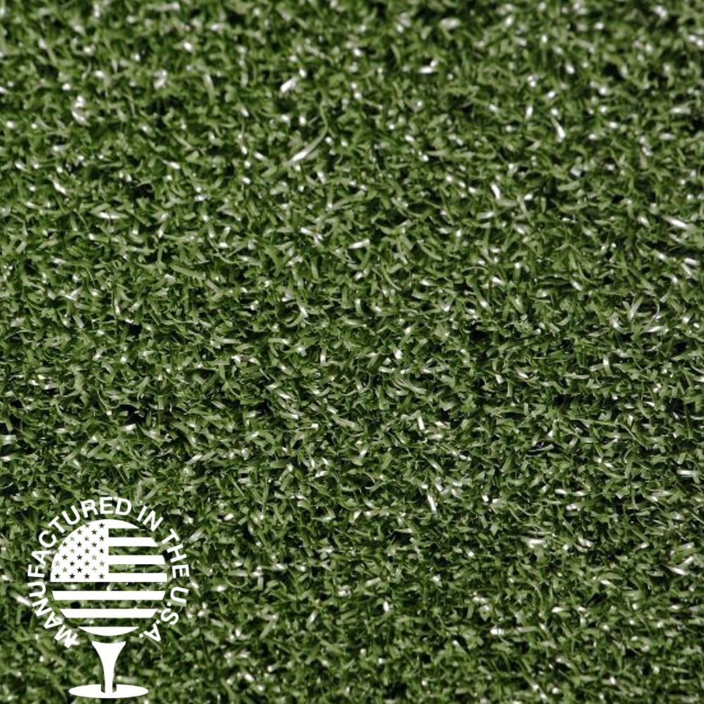 A close up of fake grass with a manufactured in the USA logo. A close up of fake grass with a manufactured in the USA logo.